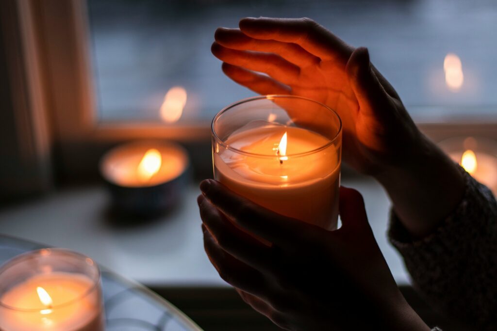Person holding a candel
