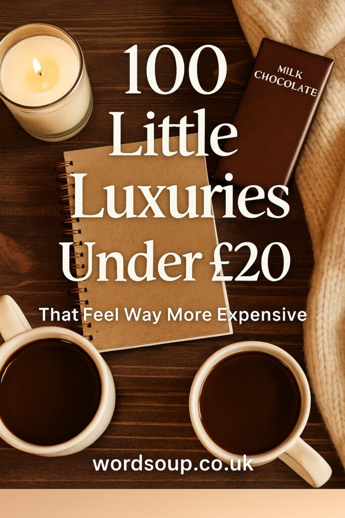 A cosy flat lay with two cups of coffee, a lit candle, a chocolate bar, a notebook, and a cream blanket. Overlaid text reads: 100 Little Luxuries Under £20 That Feel Way More Expensive. wordsoup.co.uk.